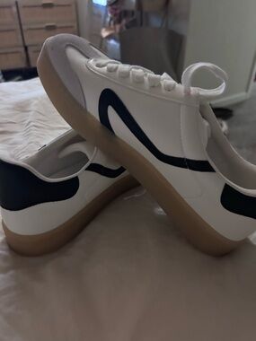 Women’s White Low-Top Sneakers with Black Accent